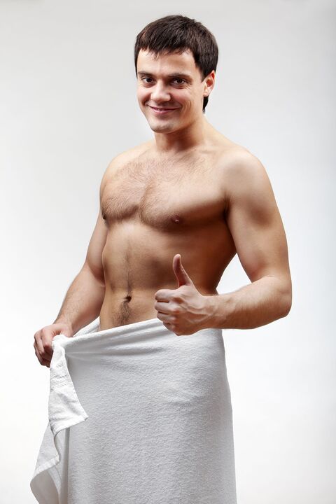 the man in the towel is satisfied with the increase in the size of his penis